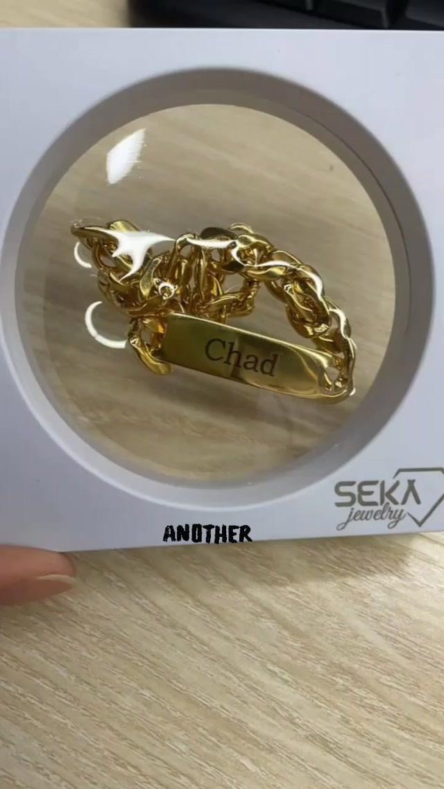 Personalized gold ID bracelet engraved with a name